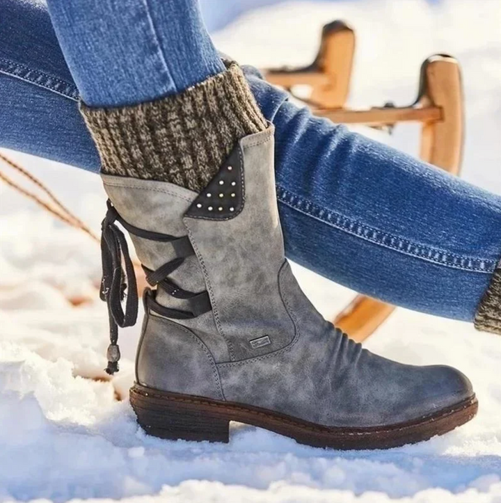 Perpetua grey knit cuff mid-calf boot, close-up side view in snow