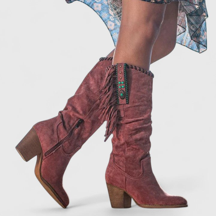 Primrose fringed knee-high boots in dusty rose, close-up studio shot