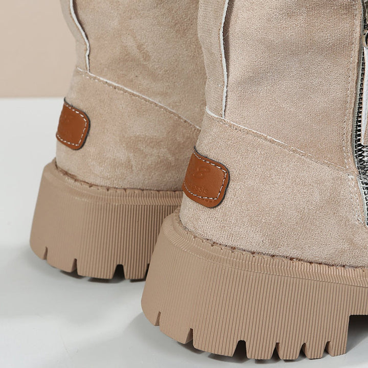 Close-up of Primrose ankle boot heel with brand patch detail
