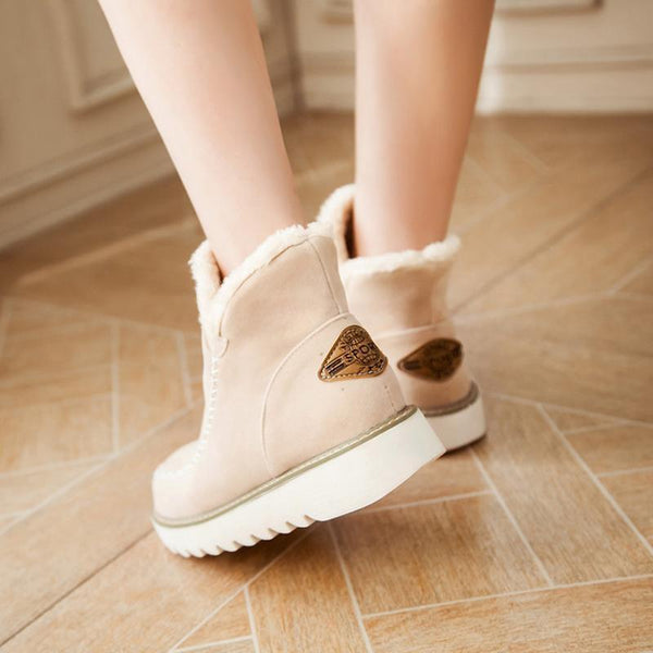 Rosalie fleece lined ankle boots in pale pink, back view on model