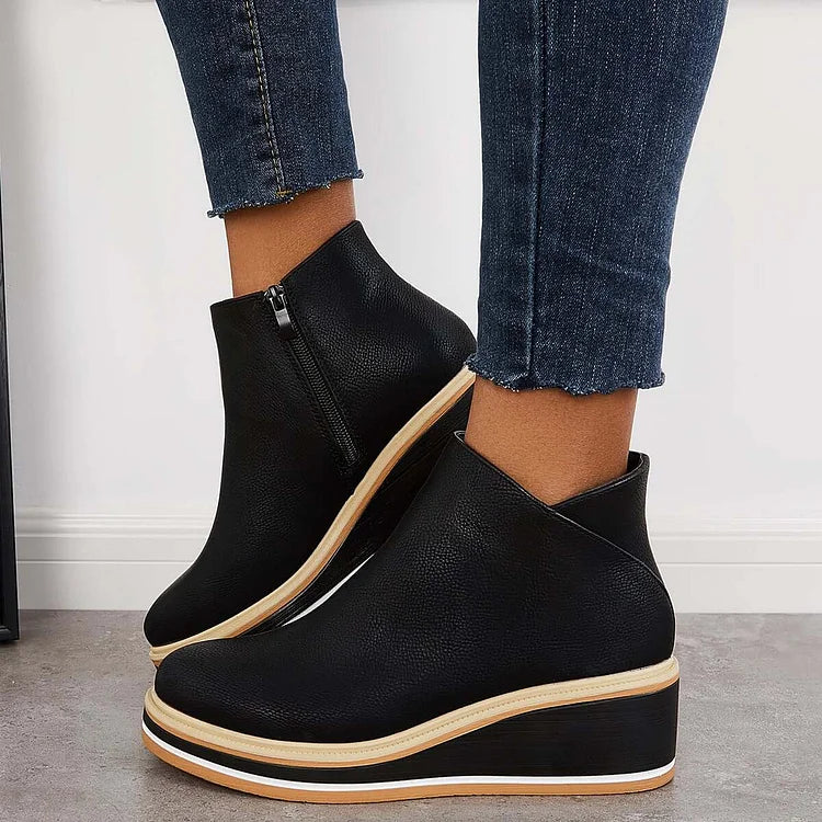 Rosalie black wedge platform ankle boots on model, side profile