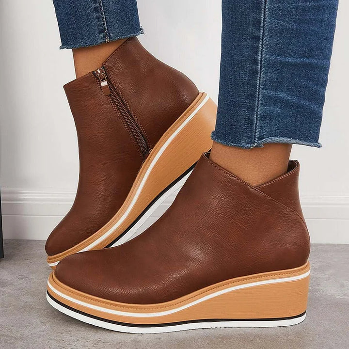Rosalie brown wedge platform ankle boots on model, side profile