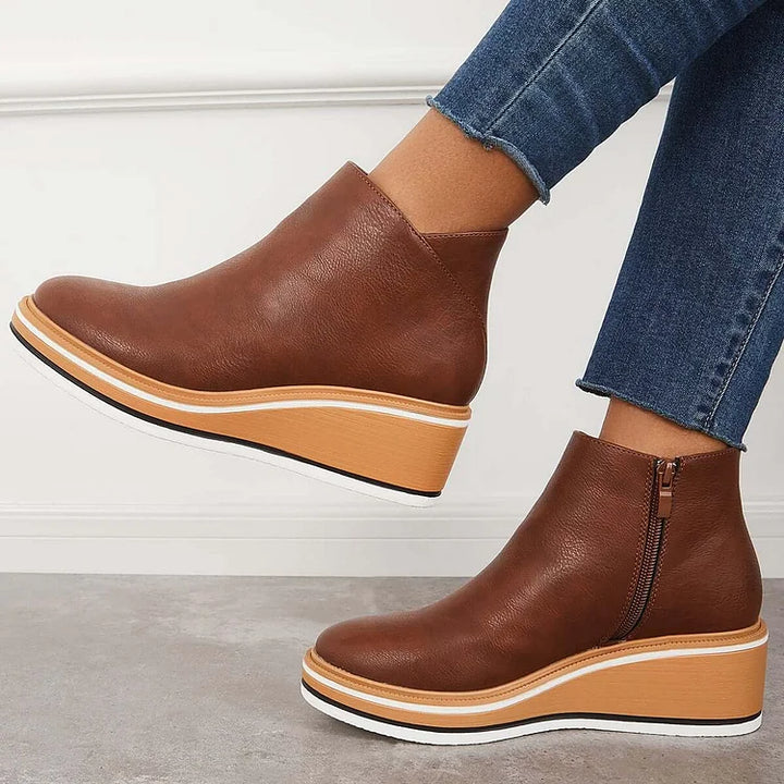 Rosalie brown wedge platform ankle boots on model, angled view