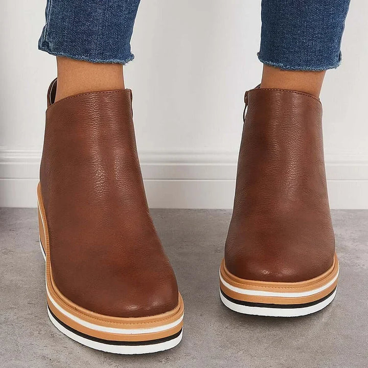 Rosalie brown wedge platform ankle boots on model, back view