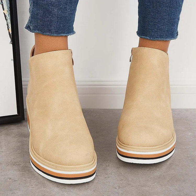 Rosalie beige wedge platform ankle boots on model, back view