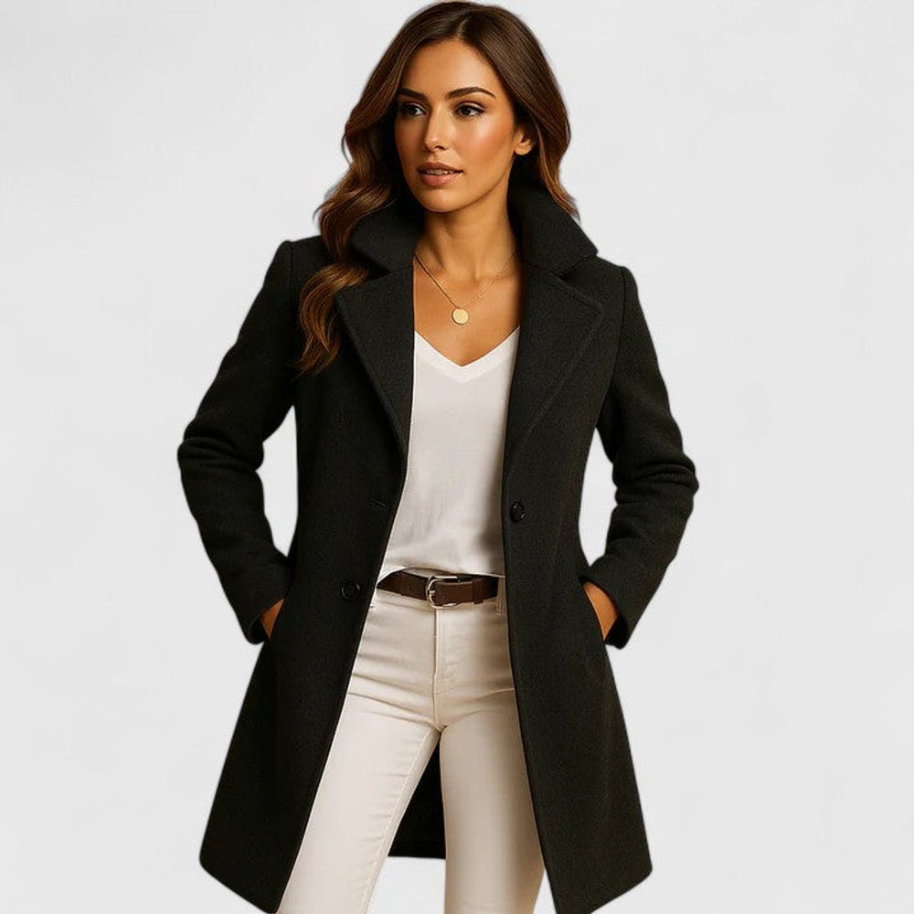 Sylvie tailored longline coat in black, front view with hands in pockets