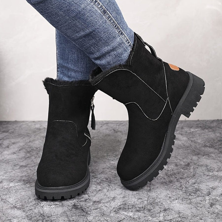 Wren fur lined ankle boots in black suede, rear view on model