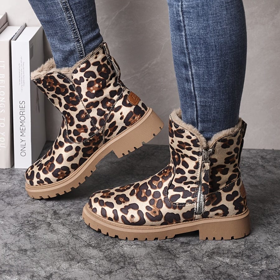Wren fur lined ankle boots in leopard print, side view on model