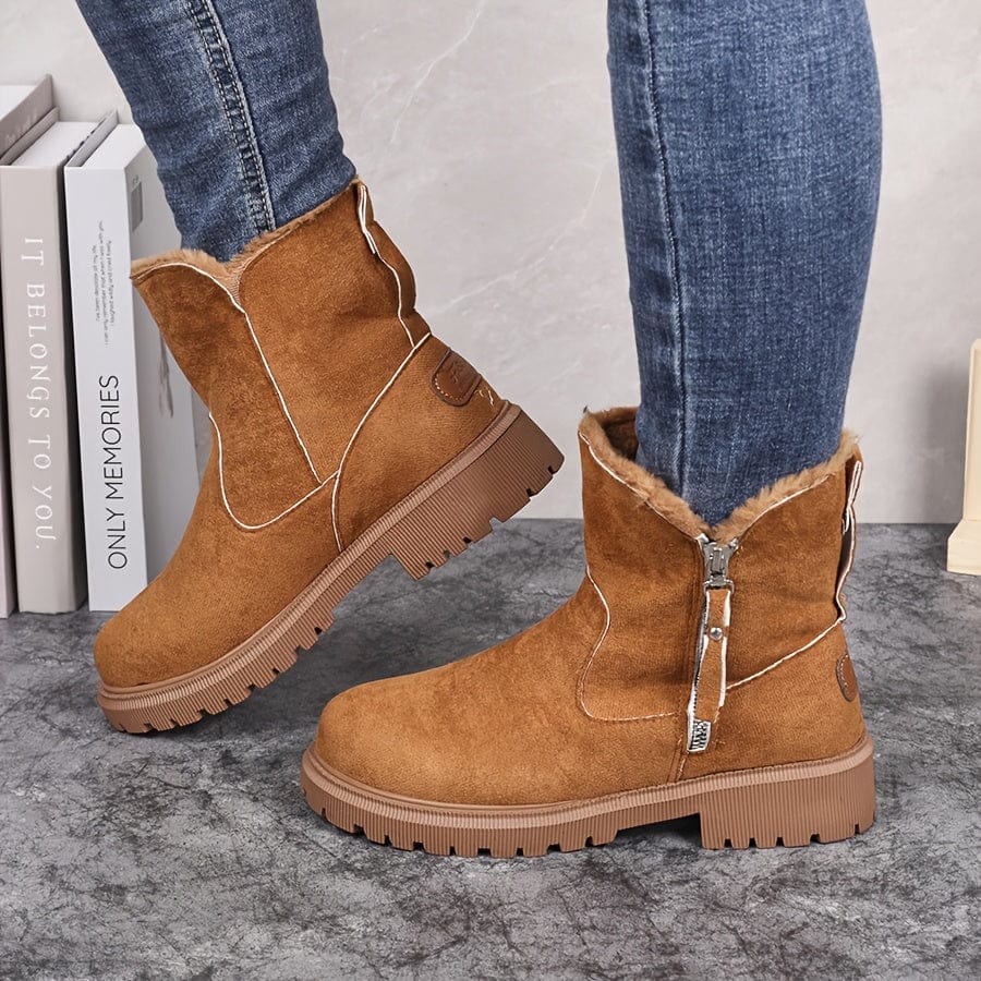 Wren fur lined ankle boots in tan suede, side profile on model